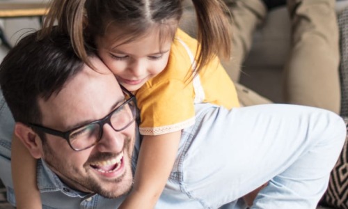 a man and child playing