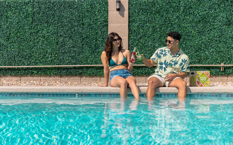 residents have drinks at the pool