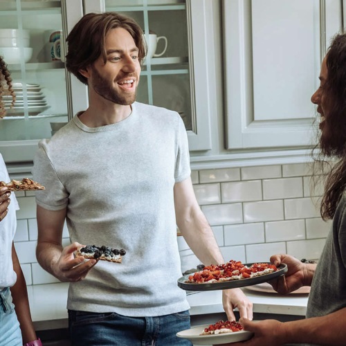 groups of friends talk in kitchen
